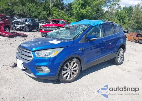 2017 Ford Escape Titanium z USA, uszkodzony, nr VIN 1FMCU0J9XHUF04442